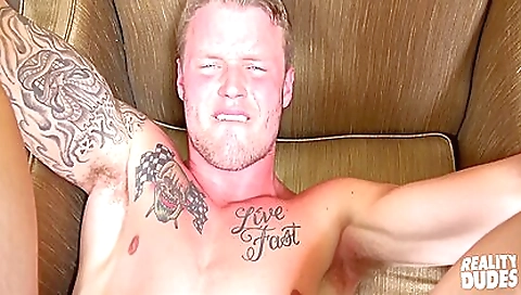 Tattooed blonde in a red dress fucks her pussy deepthroats