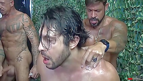 Tattooed military crew is doing a group sex with a busty woman