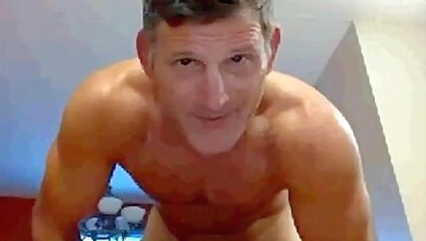 A couple of old men with a dildo making it all together