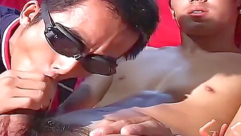 Asian babe gives a very hot blowjob to her best friend