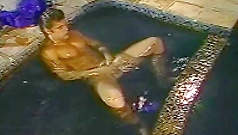 Antique brunette and a white skirt is alone on the jacuzzi