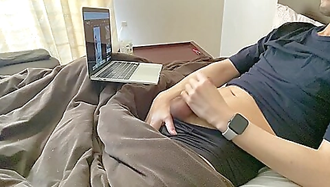 Asian solo guy masturbating in bed on his computer