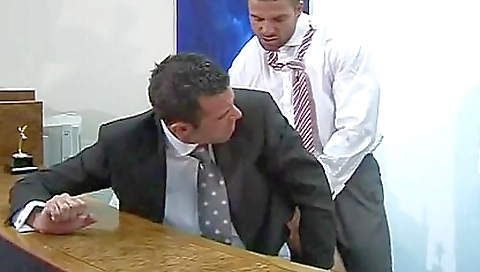 Two tattooed office workers with pretty tattoos fuck in doggy